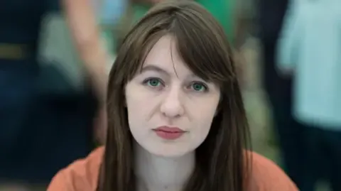 The acclaimed novelist claims she is unable to visit the UK because of legal concerns